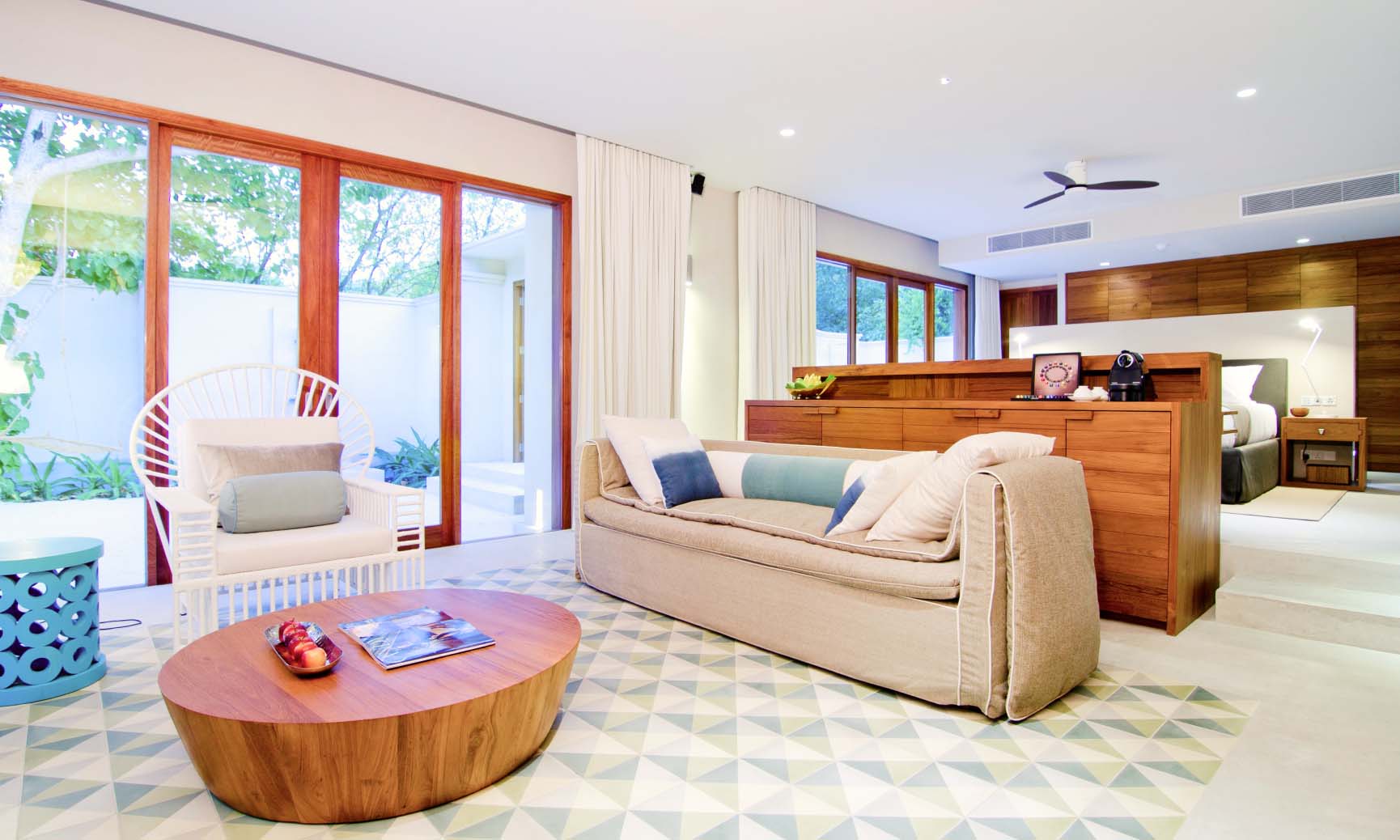 The living room and bedroom inside of our Maldives Beach Villa with pool.