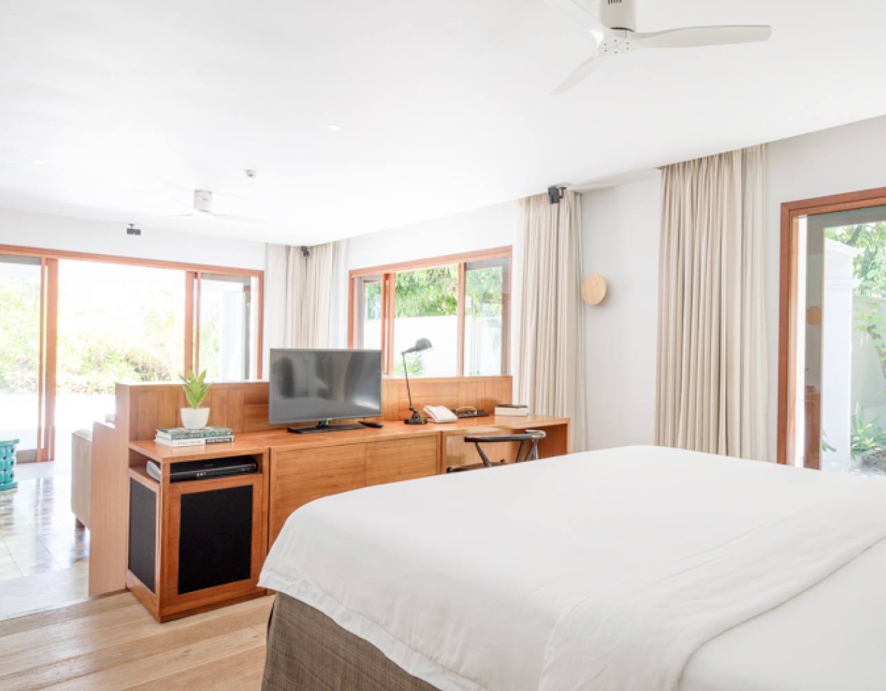 The bedroom inside of the Maldives Beach Villa with Pool.