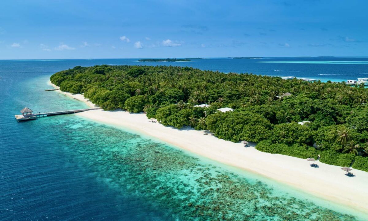 A view of the Amilla Maldives Resort and Residences secluded beaches and, dock, and Maldives reef