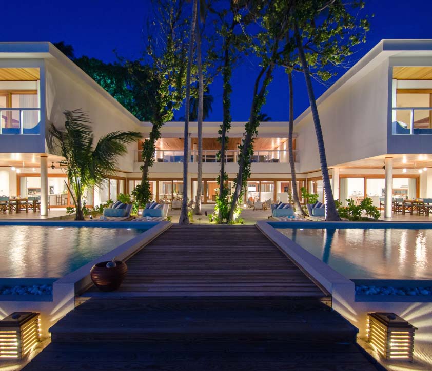 An exterior shot of the Great Beach Residence and 2 private freshwater pools at our luxury vacation rentals for large groups.