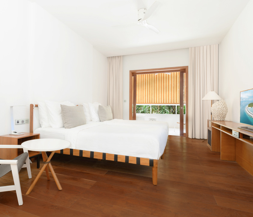 A guest suite with 2 twin beds, ensuite bathroom and private balcony in our private residence in the Maldives.