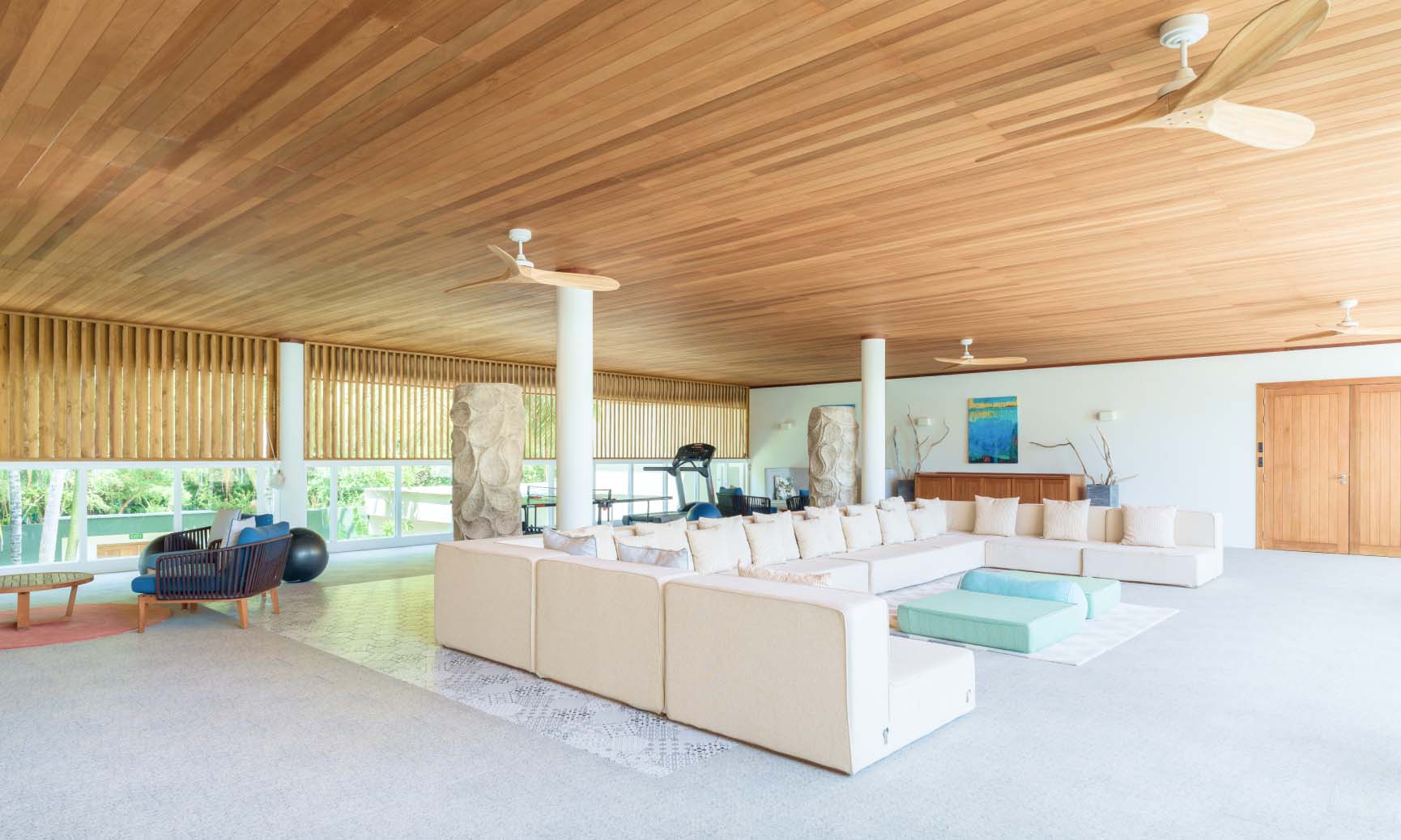 The games terrace with table tennis, board games, private gym, & ample seating in our luxury vacation rental for large groups