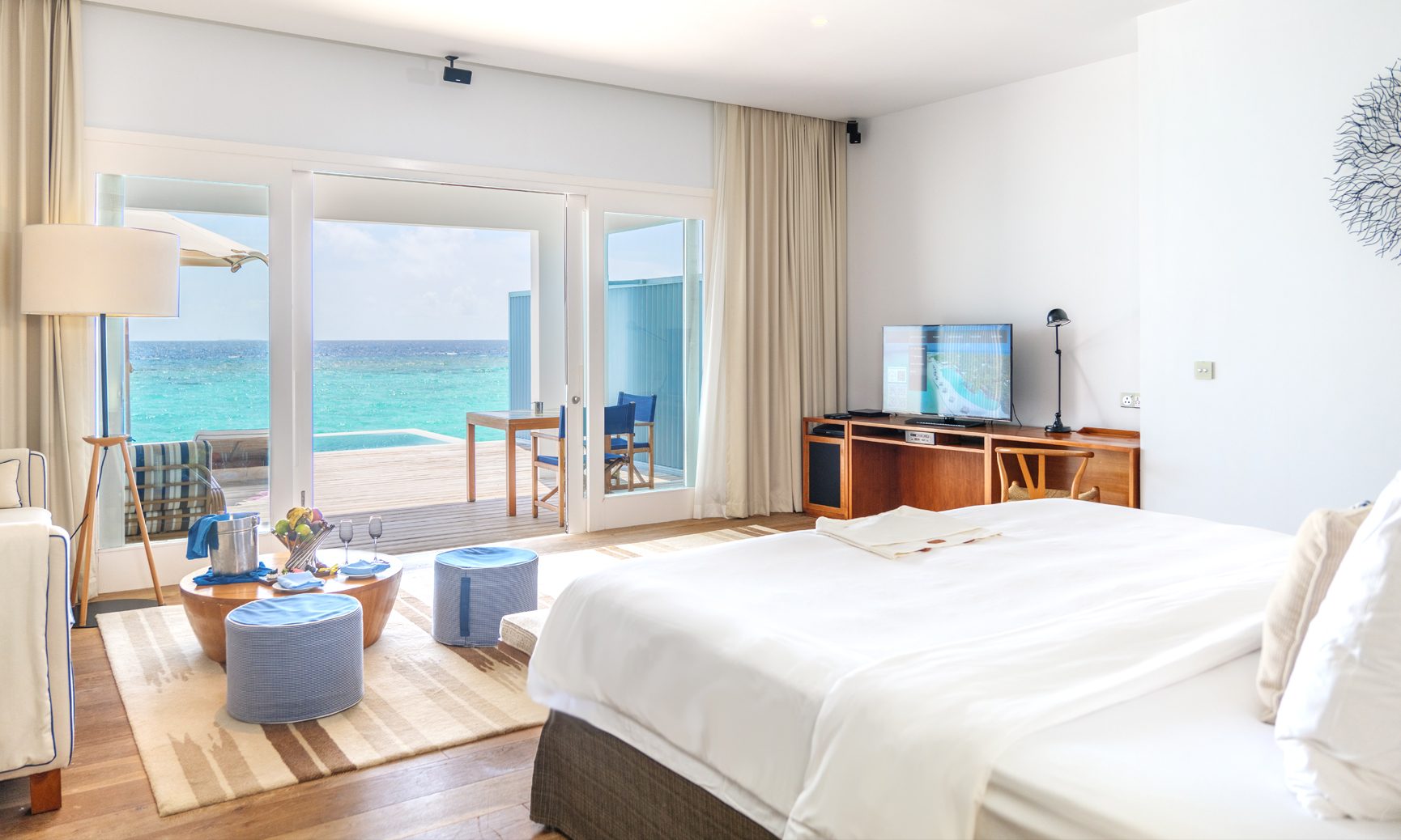 The ocean view from the 1 bedroom with 1 king bed inside of our Sunset Water Villa Maldives.