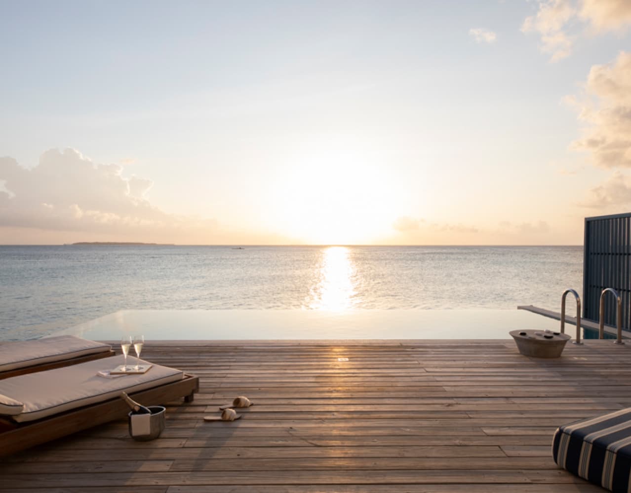 The view of the sunset from the private freshwater pool at our Sunset Water Villa Maldives.